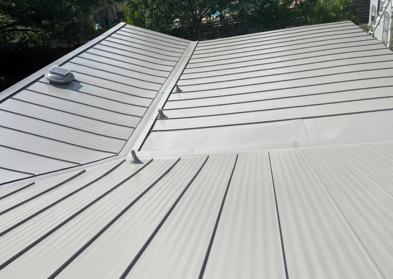 Solar attic fan installed on a metal roof for Roof Ventilation in Yakima